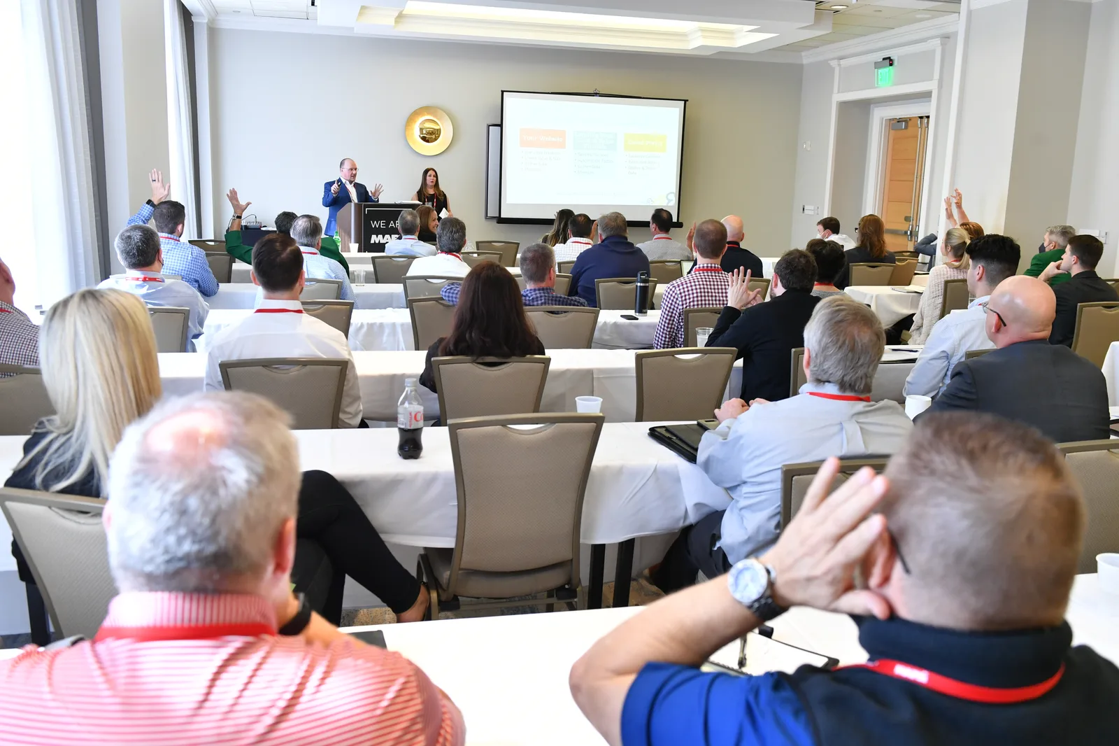 Eric speaking to a room of business owners at a conference